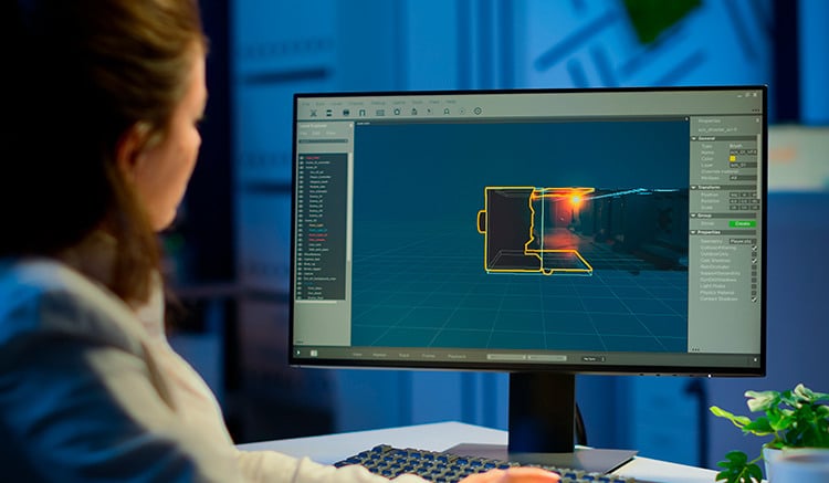 Una mujer diseña en un PC una animación en 3D.